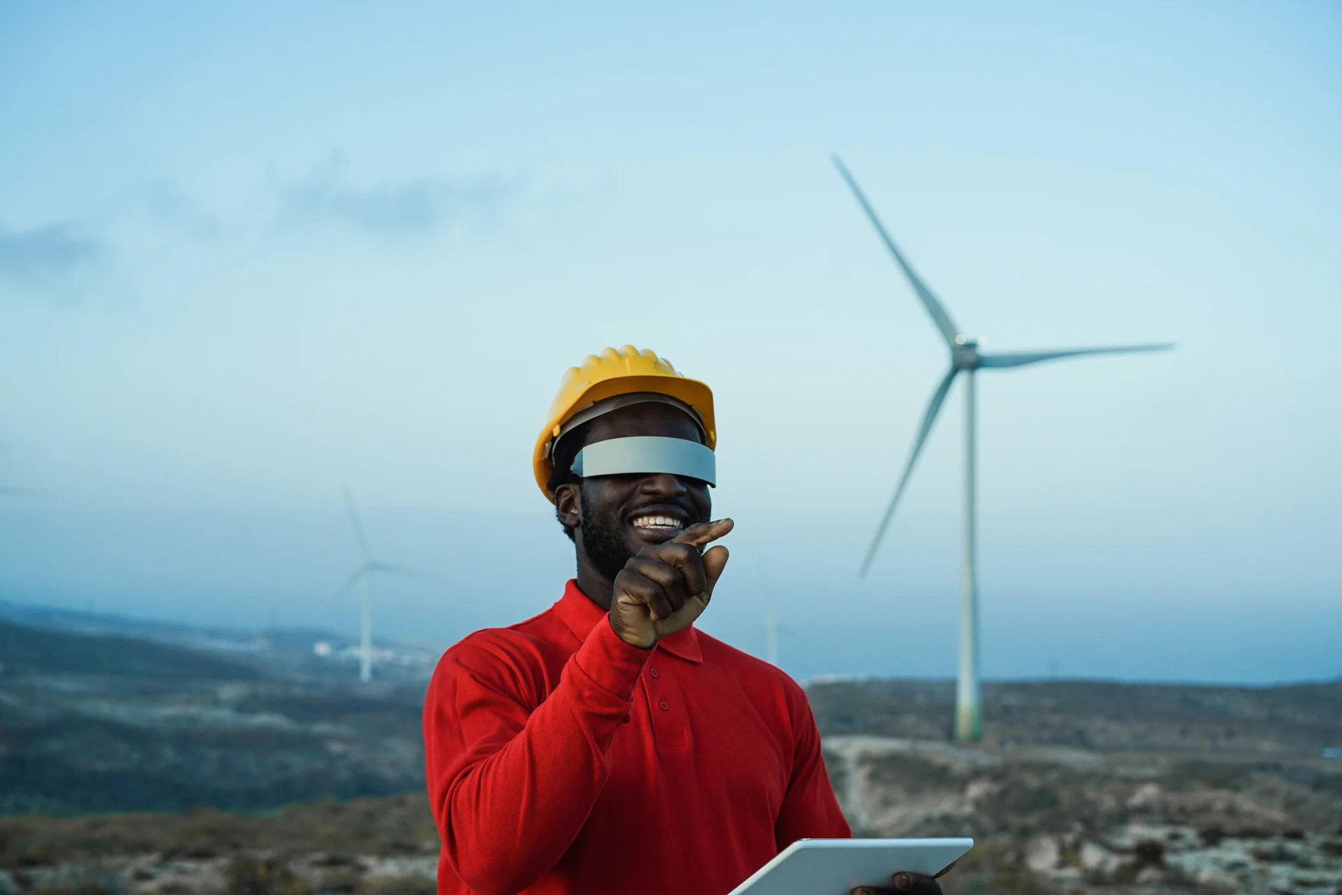 african-engineer-man-using-futuristic-augmented-reality-glasses-windmill-farm-focus-hand